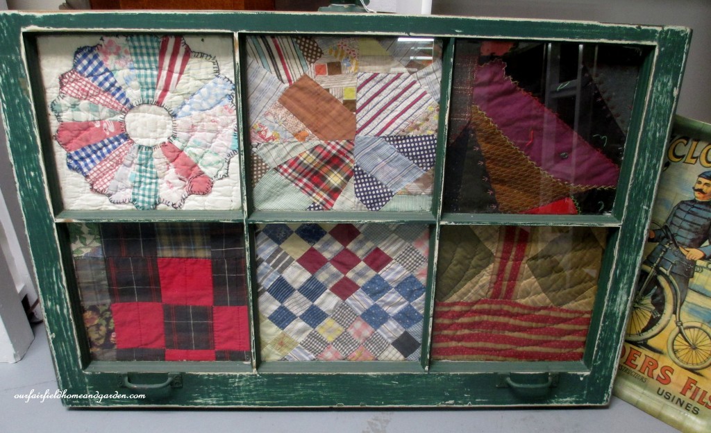 Quilt scraps framed in an old window http://ourfairfieldhomeandgarden.com/recycled-window-picture-frame/