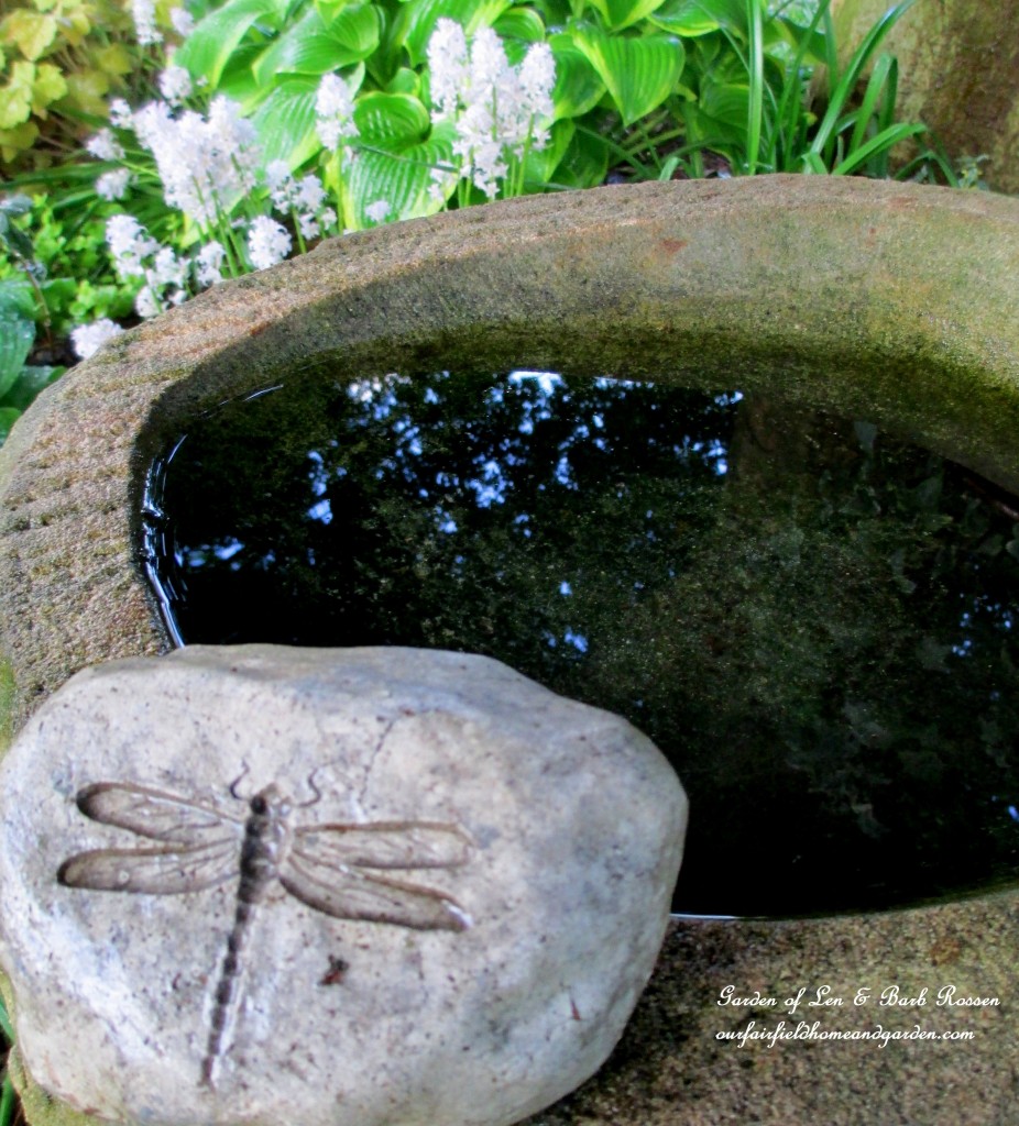Stone Birdbath https://ourfairfieldhomeandgarden.com/may-garden-birdhouses-flowers/