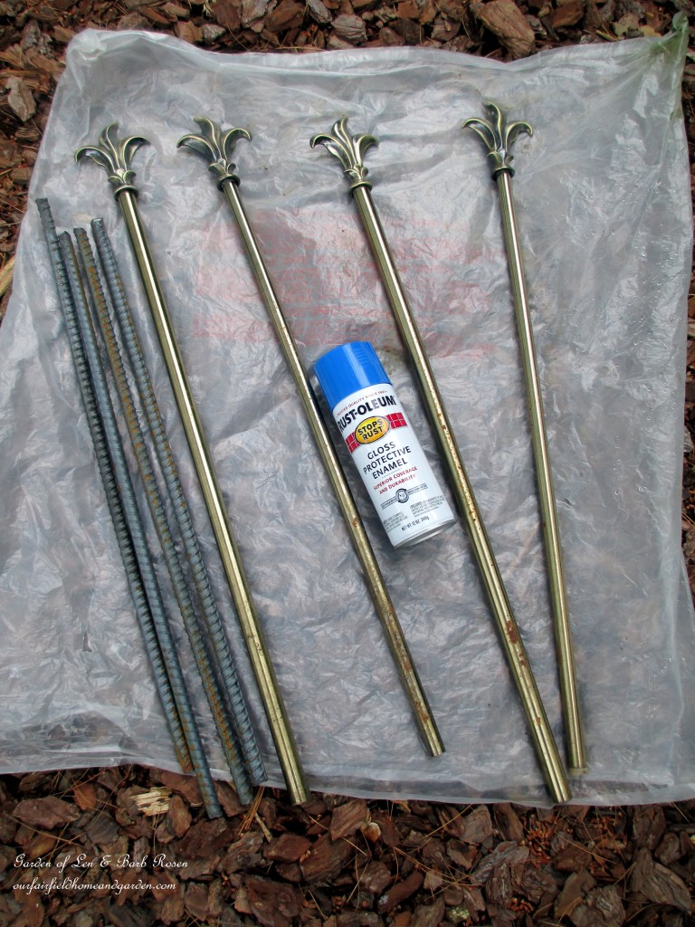 materials ~ rebar , curtain rods and paint https://ourfairfieldhomeandgarden.com/diy-project-hose-guides-from-curtain-rods/