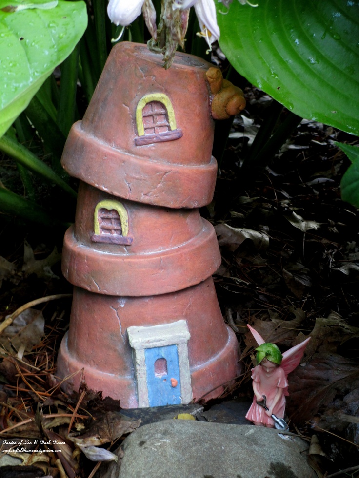 Fairy and flowerpot home https://ourfairfieldhomeandgarden.com/charmed-gardens-a-collection-of-fairy-miniature-garden-making-tips/