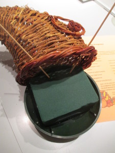 Bamboo skewers anchor the basket to the centerpiece and are snipped after placement.