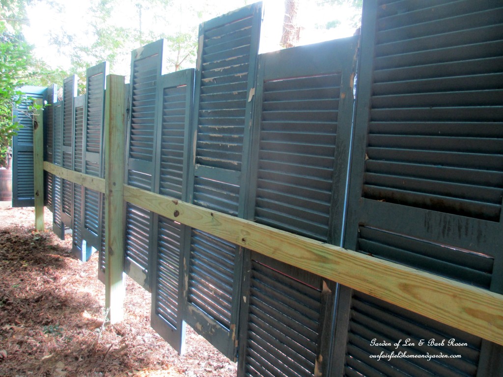 Salvaged Shutter Fence https://ourfairfieldhomeandgarden.com/salvaged-build-a-fence-from-shutters/